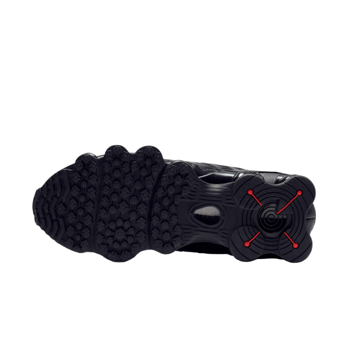 Black Nike sneakers with visible branding on a white background