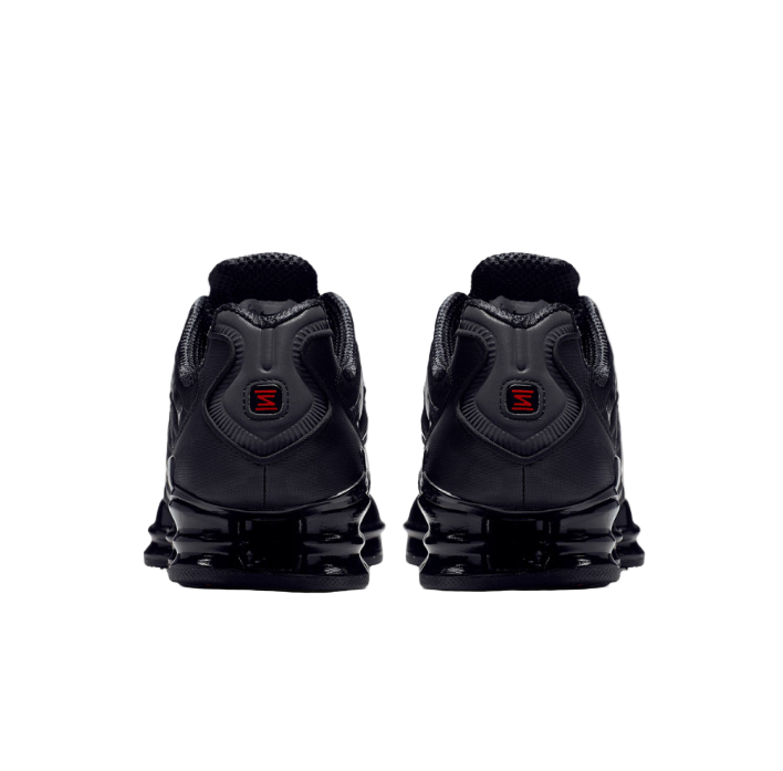 Black sneakers with red accents on a white background